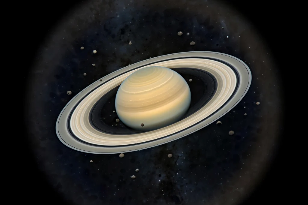 Saturn glowing above the horizon with a swarm of small moons around it
